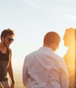 Photo of three happy friends outdoors